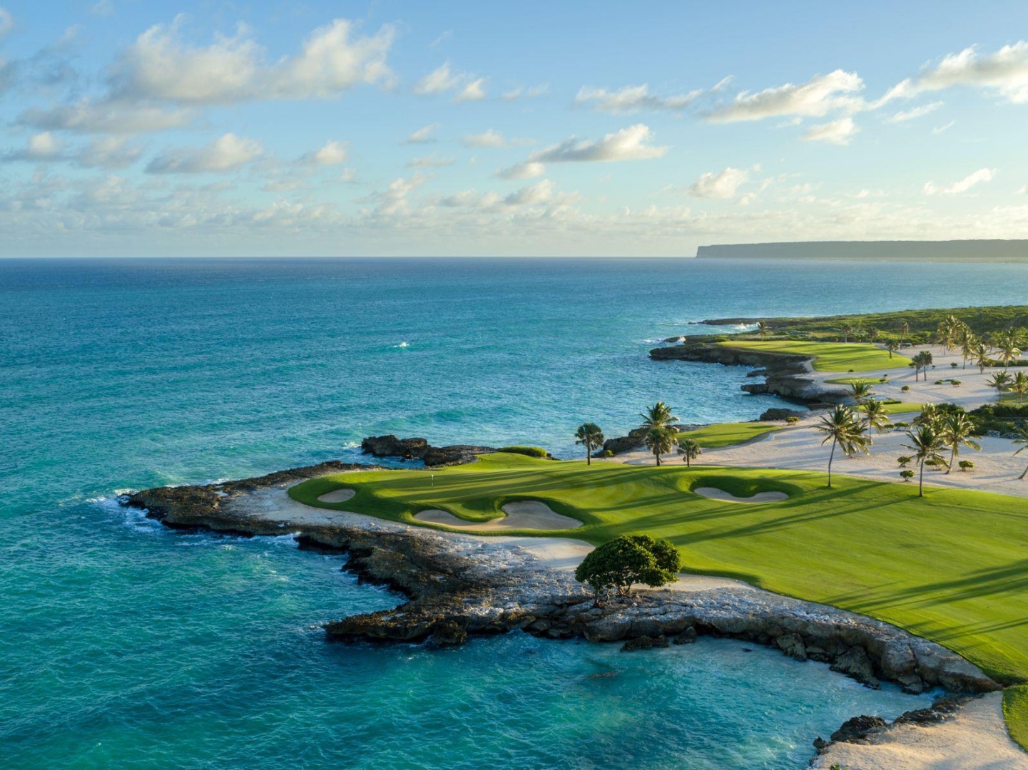 Aerial view of Punta Espada Golf Club's signature oceanfront hole